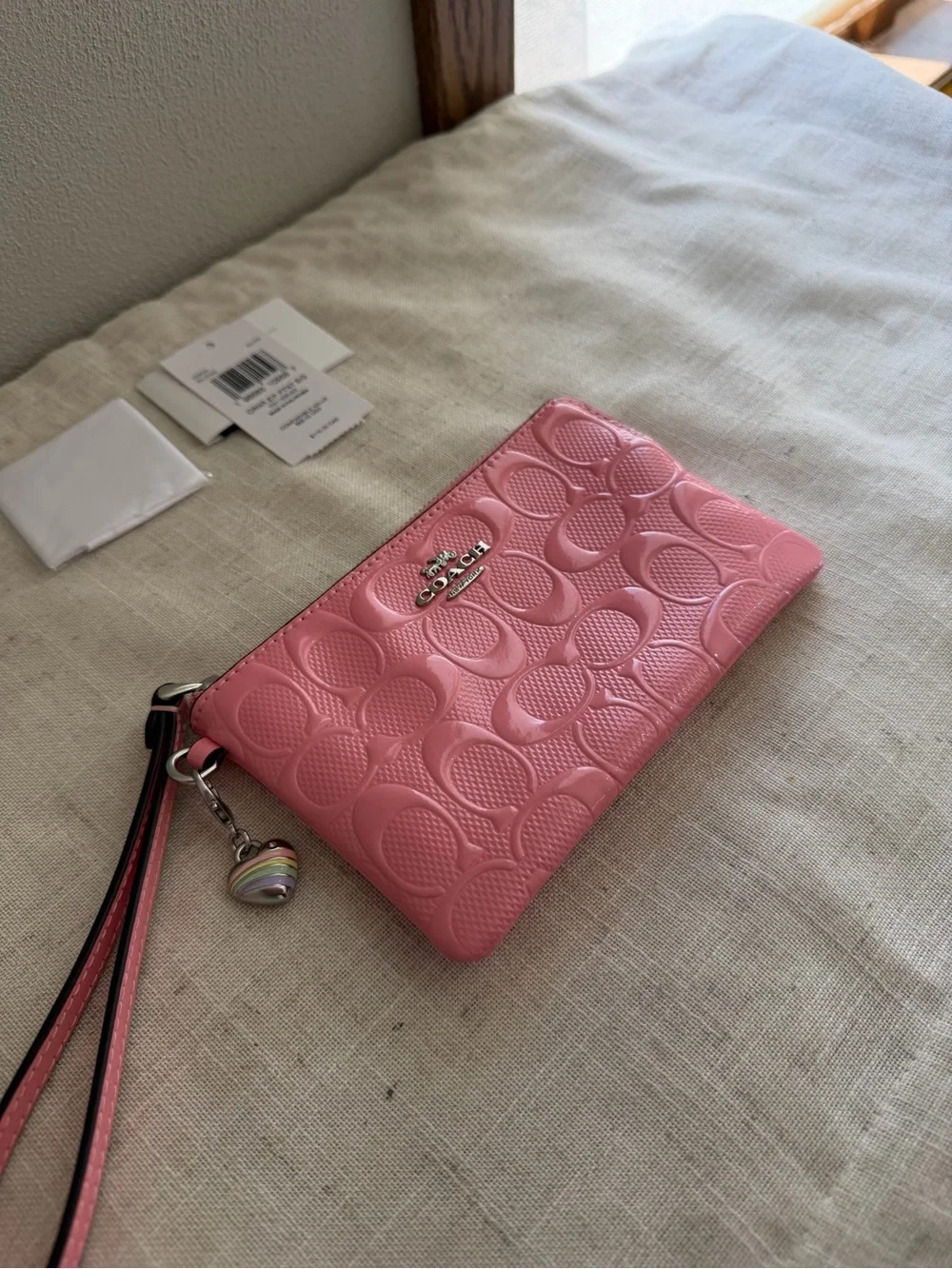 Coach Pink Corner Zip Signature Embossed Leather Wristlet with Heart Charm NWT